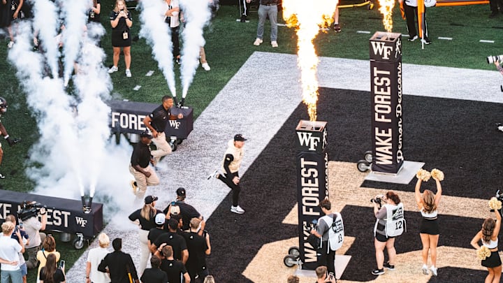 Jake Dickert running onto the field before kickoff between Wake Forest and Kennesaw State, Aug. 29, 2025.