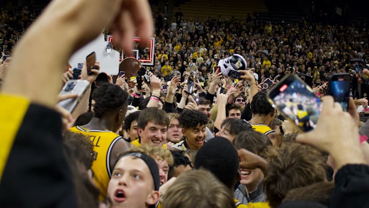 Dec 8, 2024; Columbia, Missouri, USA; Missouri Tigers fans storm the court at Mizzou Arena after the team's win over No. 1 Kansas. Dec 8, 2024; Columbia, Missouri, USA; Missouri Tigers fans storm the court at Mizzou Arena after the team's win over No. 1 Kansas.
