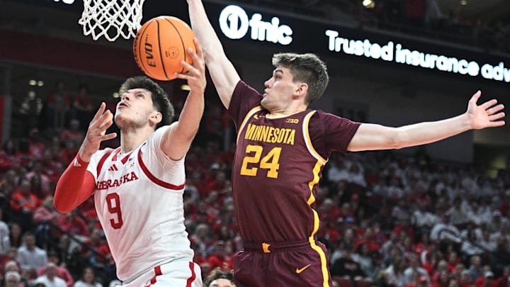 Mar 1, 2025; Lincoln, Nebraska, USA;  Minnesota Golden Gophers guard Mike Mitchell Jr. (2) defends a shot attempt from Nebraska Cornhuskers forward Berke Buyuktuncel (9) during the first half at Pinnacle Bank Arena. Mandatory Credit: Steven Branscombe-Imagn Images