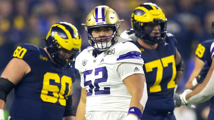 Huskies edge Voi Tunuufi (52) is shown in the CFP national title game against Michigan. He was a key performer in Saturday's game in Seattle. 