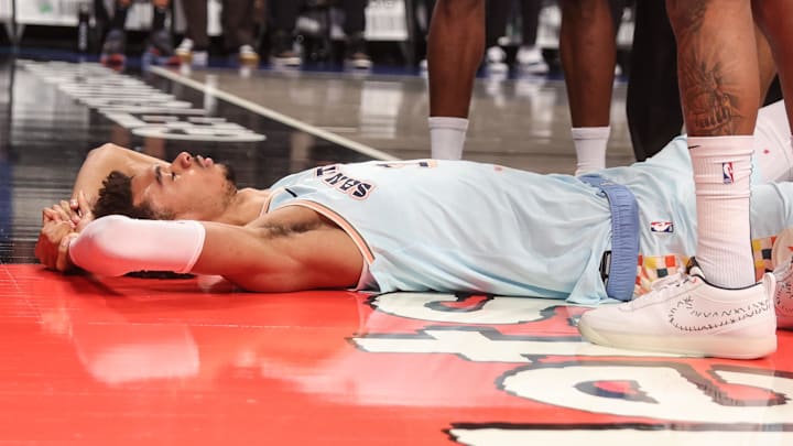 Dec 27, 2024; Brooklyn, New York, USA;  San Antonio Spurs center Victor Wembanyama (1) lays on the court after getting fouled in the third quarter against the Brooklyn Nets at Barclays Center. Mandatory Credit: Wendell Cruz-Imagn Images
