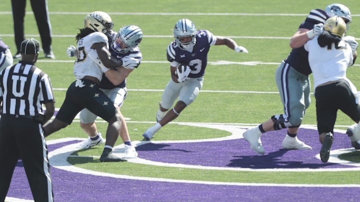 Kansas State Wildcats running back Dylan Edwards finds an opening in Wildcats' win over USF.