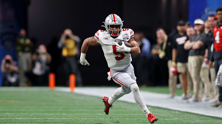 Dec 31, 2022; Atlanta, Georgia, USA; Ohio State Buckeyes running back Dallan Hayden (5) runs with