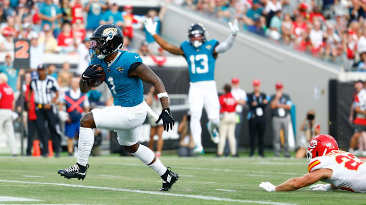 Aug 10, 2024; Jacksonville, Florida, USA; Jacksonville Jaguars running back Travis Etienne Jr. (1) runs the ball in for a touchdown during the first quarter against the Kansas City Chiefs at EverBank Stadium. Mandatory Credit: Douglas DeFelice-Imagn Images