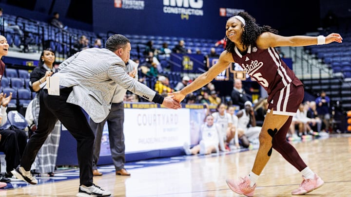 Mississippi State coach Sam Purcell high fives Chandler Prater during Saturday's game against La Salle.