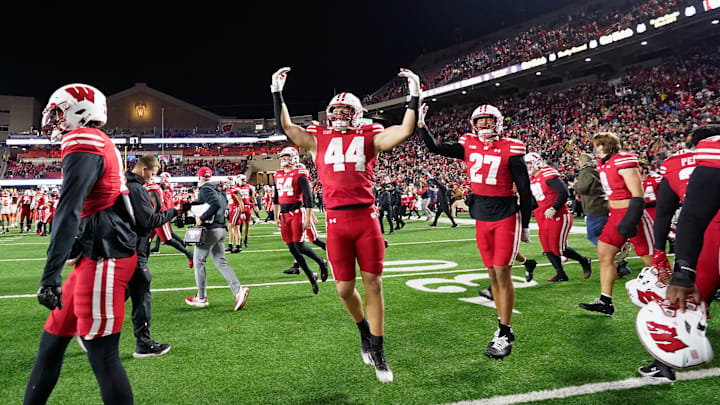 Nov 22, 2025; Madison, Wisconsin, USA; Wisconsin Badgers linebacker Cooper Catalano (44) and Wisconsin Badgers safety Raphael Dunn (27) react to winning 27-10 against the Illinois Fighting Illini at Camp Randall Stadium. Mandatory Credit: Kayla Wolf-Imagn Images Nov 22, 2025; Madison, Wisconsin, USA; Wisconsin Badgers linebacker Cooper Catalano (44) and Wisconsin Badgers safety Raphael Dunn (27) react to winning 27-10 against the Illinois Fighting Illini at Camp Randall Stadium. Mandatory Credit: Kayla Wolf-Imagn Images