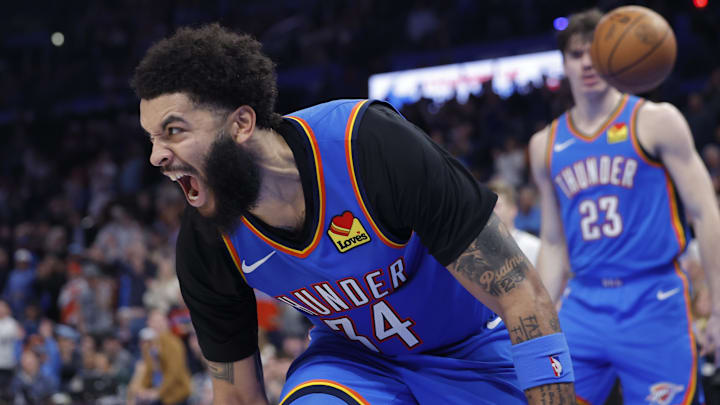 Dec 22, 2025; Oklahoma City, Oklahoma, USA; Oklahoma City Thunder guard Kenrich Williams (34) screams after scoring a basket against the Memphis Grizzlies during the second half at Paycom Center.