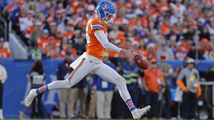 Jan 4, 2026; Denver, Colorado, USA; Denver Broncos punter Jeremy Crawshaw (16) punts the ball during the game against the Los Angeles Chargers during the first half at Empower Field at Mile High. Mandatory Credit: Isaiah J. Downing-Imagn Images