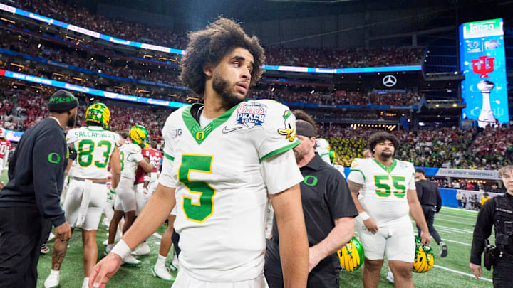 Oregon quarterback Dante Moore walks the field after the Ducks’ loss as the Oregon Ducks face the Indiana Hoosiers in the Peach Bowl on Jan. 9, 2026, at Mercedes-Benz Stadium in Atlanta, Georgia.