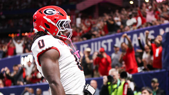 Dec 6, 2025; Atlanta, GA, USA; Georgia Bulldogs running back Roderick Robinson II (0) celebrates after scoring a touchdown during the first quarter against the Alabama Crimson Tide during the 2025 SEC Championship game at Mercedes-Benz Stadium. Mandatory Credit: Brett Davis-Imagn Images