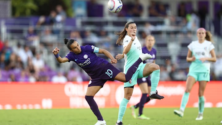 Nov 17, 2024; Orlando, FL, USA; Orlando Pride forward Marta (10) and Kansas City Current midfielder Vanessa DiBernardo (16) battle for the ball in a NWSL playoff semifinal match at Inter&Co Stadium. Mandatory Credit: Nathan Ray Seebeck-Imagn Images