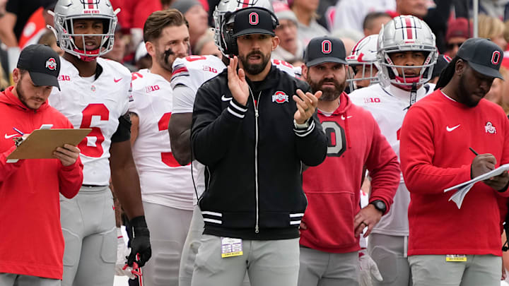 Ohio State Buckeyes linebackers coach James Laurinaitis applauds from the sideline during the NCAA football game against the Northwestern Wildcats at Wrigley Field in Chicago on Monday, Nov. 18, 2024. Ohio State won 31-7.