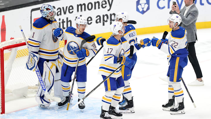 Nov 20, 2024; Los Angeles, California, USA;  Buffalo Sabres left wing Jason Zucker (17) celebrates a victory with right wing Jack Quinn (22) after defeating the Los Angeles Kings 1-0 at Crypto.com Arena. Mandatory Credit: Kiyoshi Mio-Imagn Images