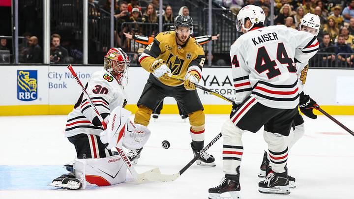 Sep 29, 2026; Las Vegas, Nevada, USA;  Vegas Golden Knights center Brett Howden (21) looks to redirect the puck towards the goal being defended by Chicago Blackhawks goaltender Spencer Knight (30) during the third period at T-Mobile Arena.  Mandatory Credit: Christopher Trim-Imagn Images