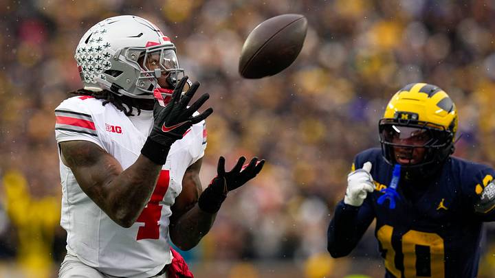 Ohio State Buckeyes wide receiver Jeremiah Smith (4) catches a pass against the Michigan Wolverines in the first half of the NCAA football game at Michigan Stadium on Saturday, Nov. 29, 2025 in Ann Arbor, Michigan.