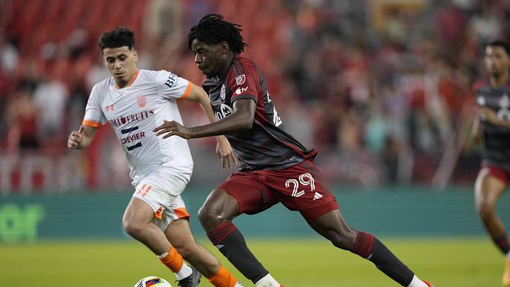 Deandre Kerr advances the ball as CS Saint-Laurent midfielder Safwane Mlah on his way to his four-goal performance. 