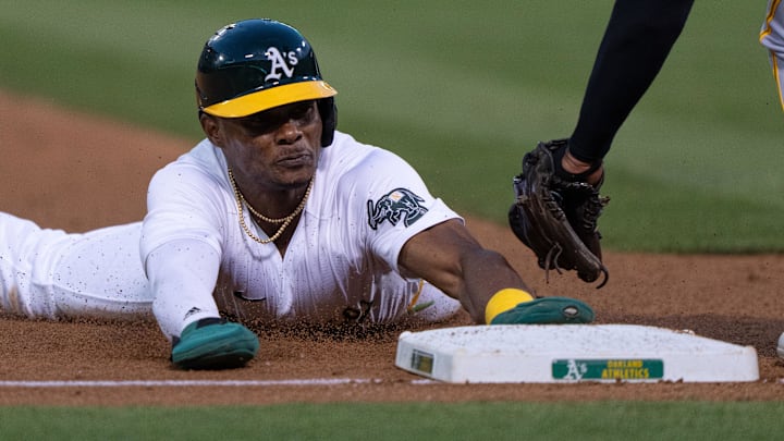 Oakland Athletics outfielder Esteury Ruiz (1) slides 