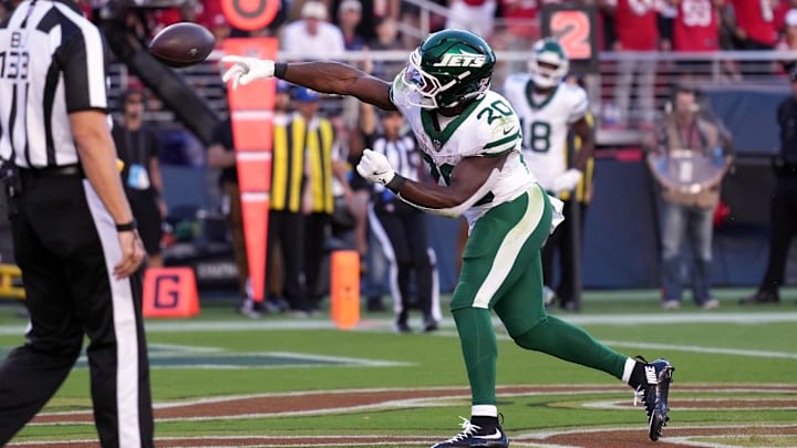 Sep 9, 2024; Santa Clara, California, USA; New York Jets running back Breece Hall (20) throws the ball after scoring a touchdown against the San Francisco 49ers during the first quarter at Levi's Stadium. Sep 9, 2024; Santa Clara, California, USA; New York Jets running back Breece Hall (20) throws the ball after scoring a touchdown against the San Francisco 49ers during the first quarter at Levi's Stadium.