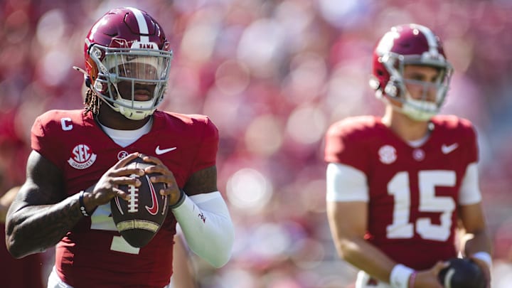 Alabama Crimson Tide quarterback Jalen Milroe (4) warms up alongside quarterback Ty Simpson (15) 
