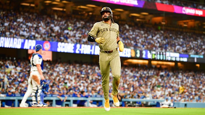 San Diego Padres right fielder Fernando Tatis Jr. (23) scores a run during the third inning against the Los Angeles Dodgers at Dodger Stadium on June 17. San Diego Padres right fielder Fernando Tatis Jr. (23) scores a run during the third inning against the Los Angeles Dodgers at Dodger Stadium on June 17.