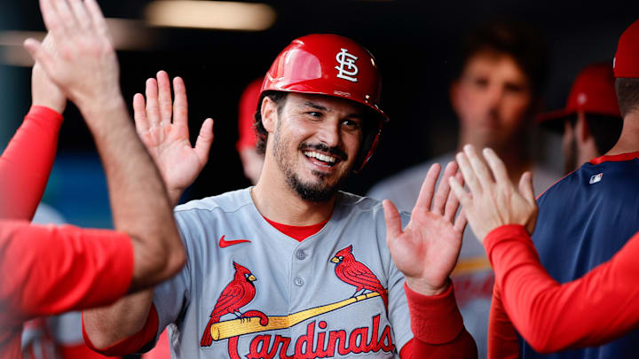 Denver, Colorado, USA; St. Louis Cardinals third baseman Nolan Arenado (28) celebrates in the dugout after scoring on an RBI in the fourth inning against the Colorado Rockies at Coors Field.