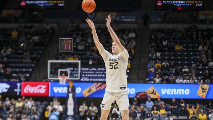 Jan 27, 2026; Morgantown, West Virginia, USA; West Virginia Mountaineers guard Treysen Eaglestaff (52) shoots during the second half against the Kansas State Wildcats at Hope Coliseum. Mandatory Credit: Ben Queen-Imagn Imagesa
