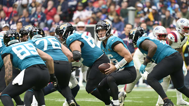 Oct 20, 2024; London, United Kingdom; Jacksonville Jaguars quarterback Trevor Lawrence (16) with the ball in the second half during an NFL International Series game at Wembley Stadium. Mandatory Credit: Peter van den Berg-Imagn Images