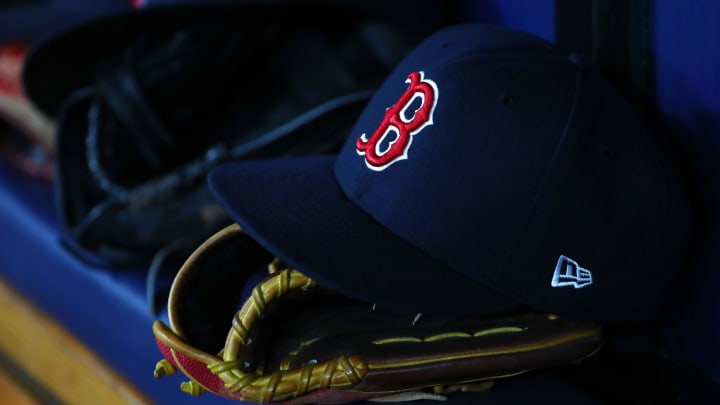 Jul 22, 2019; St. Petersburg, FL, USA; A detail view of Boston Red Sox hat and glove laying in the dugout at Tropicana Field. Mandatory Credit: Kim Klement-USA TODAY Sports