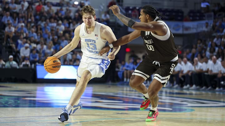 Nov 25, 2025; Fort Myers, Florida, USA; North Carolina Tar Heels center Henri Veesaar (13) drives to th basket guarded by St. Bonaventure Bonnies forward Frank Mitchell (00) in the first half at Suncoast Credit Union Arena. Mandatory Credit: Nathan Ray Seebeck-Imagn Images