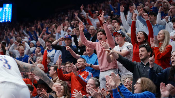 Kansas Jayhawks fans celebrate a three-pointer made against BYU Cougars by Kansas Jayhawks guard Tre White (3) during the game inside Allen Fieldhouse on Jan. 31, 2026.