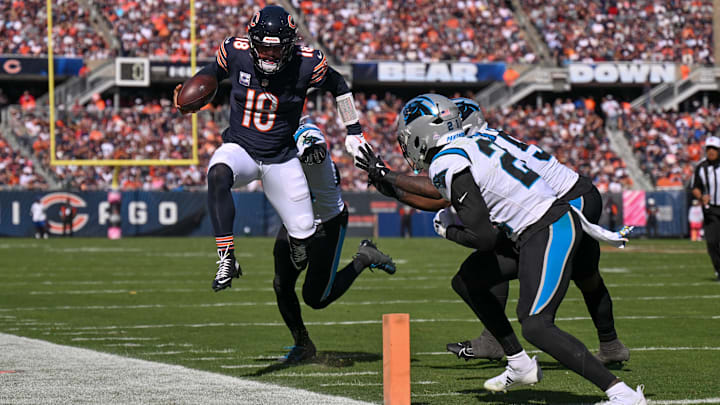 Caleb Williams leaps out of bounds but takes a cheap shot without a penalty, anyway, in the win by the Bears over Carolina.