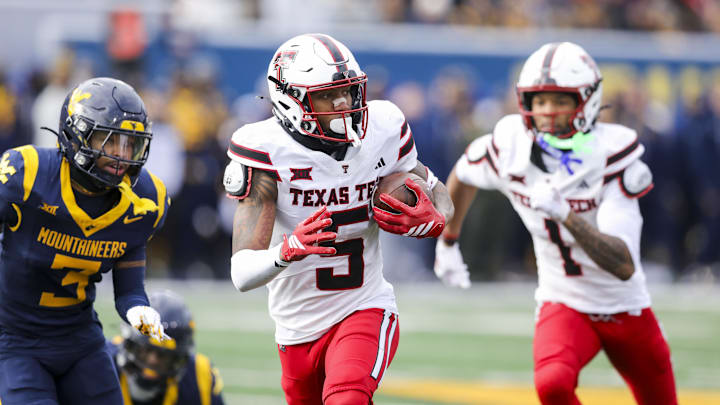 Nov 29, 2025; Morgantown, West Virginia, USA; Texas Tech Red Raiders wide receiver Caleb Douglas (5) makes a catch and runs for extra yards during the second quarter against the West Virginia Mountaineers at Milan Puskar Stadium. Mandatory Credit: Ben Queen-Imagn Images