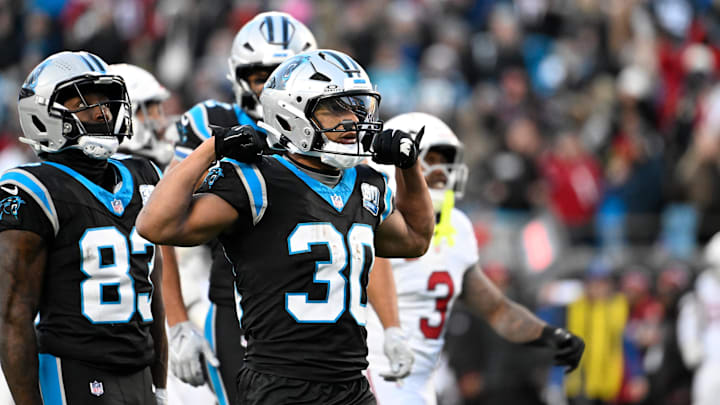 Dec 22, 2024; Charlotte, North Carolina, USA;  Carolina Panthers running back Chuba Hubbard (30) reacts after running for a first down in overtime at Bank of America Stadium. Mandatory Credit: Bob Donnan-Imagn Images
