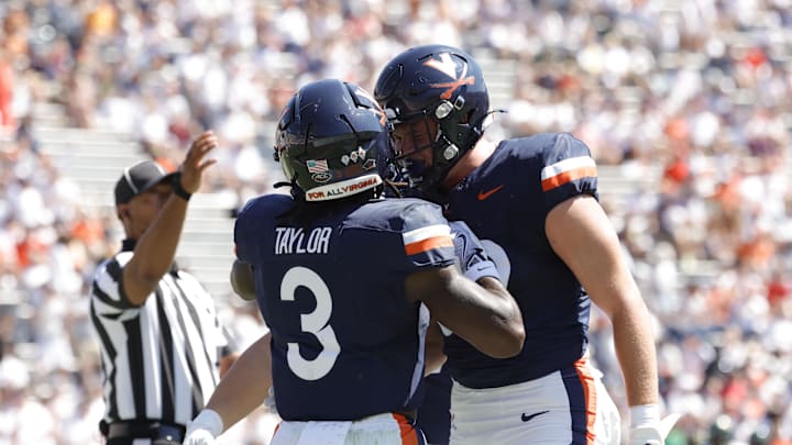 Sep 13, 2025; Charlottesville, Virginia, USA; Virginia Cavaliers running back J'Mari Taylor (3) celebrates with teammates after scoring a during the first half against the William & Mary Tribe at Scott Stadium. Mandatory Credit: Amber Searls-Imagn Images