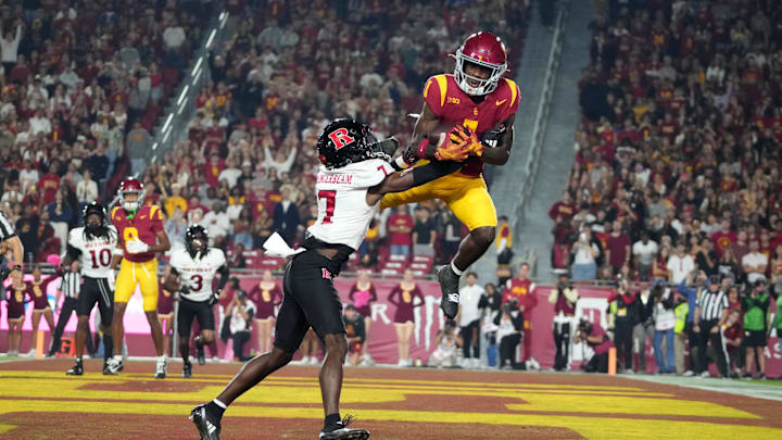 Oct 25, 2024; Los Angeles, California, USA; Southern California Trojans wide receiver Zachariah Branch (1) attempts to catch the ball against Rutgers Scarlet Knights defensive back Robert Longerbeam (7) in the first half at United Airlines Field at Los Angeles Memorial Coliseum.