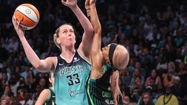 Aug 19, 2025; Brooklyn, New York, USA;  New York Liberty center Emma Meesseman (33) looks to post up against Minnesota Lynx guard DiJonai Carrington (3) in the fourth quarter at Barclays Center. Mandatory Credit: Wendell Cruz-Imagn Images