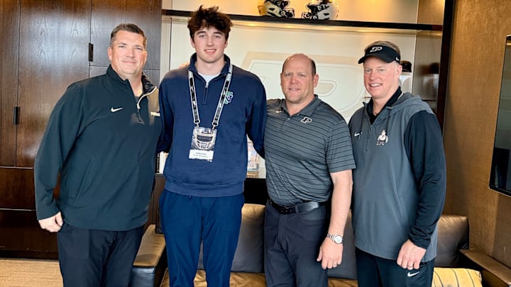 Jackie Ryder with Purdue's offensive coaching staff.