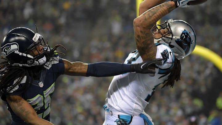 January 10, 2015; Seattle, WA, USA; Carolina Panthers wide receiver Kelvin Benjamin (13) catches a pass against the defense of Seattle Seahawks cornerback Richard Sherman (25) during the first half in the 2014 NFC Divisional playoff football game at CenturyLink Field. The play did not result in a touchdown. 