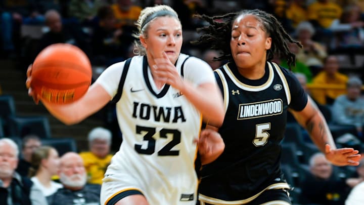 Iowa guard Callie Levin (32) drives to the basket against Lindenwood guard Aalayah Wilson (5) Dec. 13, 2025 at Carver-Hawkeye Arena in Iowa City, Iowa. Iowa guard Callie Levin (32) drives to the basket against Lindenwood guard Aalayah Wilson (5) Dec. 13, 2025 at Carver-Hawkeye Arena in Iowa City, Iowa.