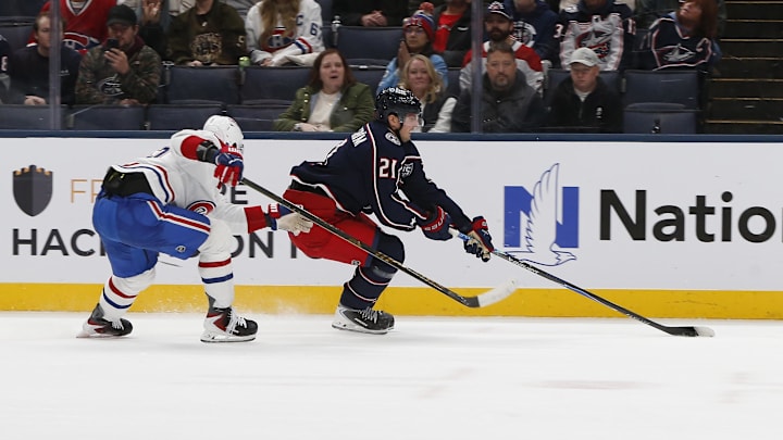 Blue Jackets center Isac Lundestrom works against Montreal Canadiens winger Ivan Demidov. Blue Jackets center Isac Lundestrom works against Montreal Canadiens winger Ivan Demidov.
