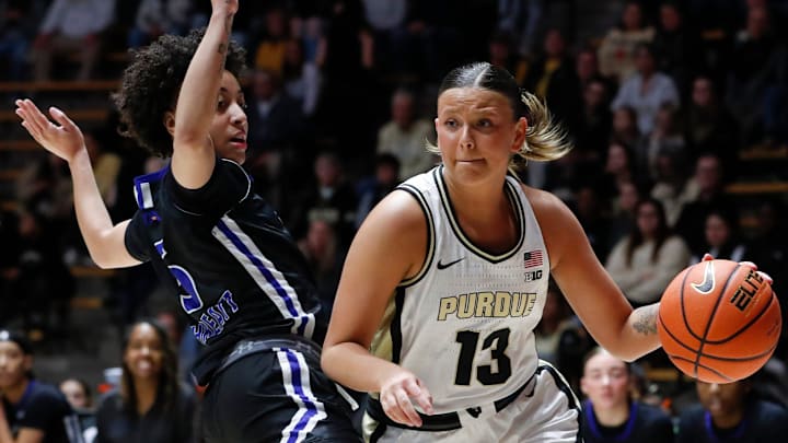 UT Arlington Mavericks guard Nya Threatt (5) defends Purdue Boilermakers guard Ella Collier (13) 