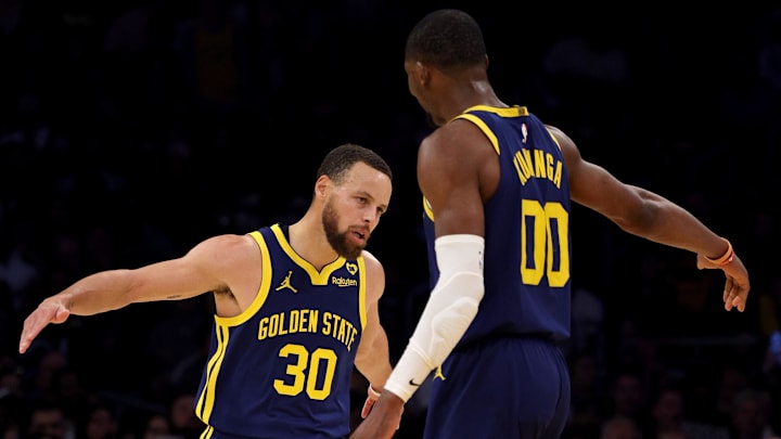 Mar 16, 2024; Los Angeles, California, USA; Golden State Warriors guard Stephen Curry (30) celebrates with forward Jonathan Kuminga (00) after a basket during the third quarter against the Los Angeles Lakers at Crypto.com Arena. Mandatory Credit: Jason Parkhurst-Imagn Images Mar 16, 2024; Los Angeles, California, USA; Golden State Warriors guard Stephen Curry (30) celebrates with forward Jonathan Kuminga (00) after a basket during the third quarter against the Los Angeles Lakers at Crypto.com Arena. Mandatory Credit: Jason Parkhurst-Imagn Images