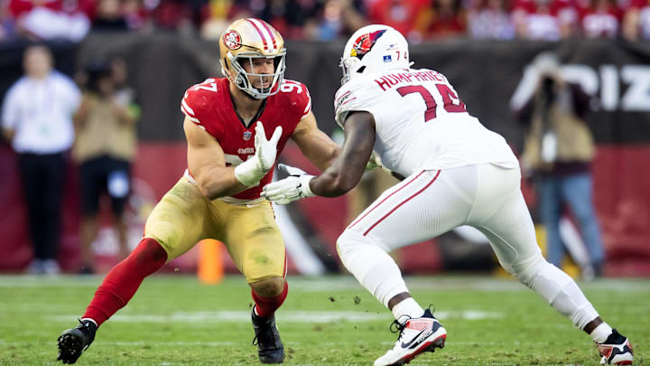 Dec 17, 2023; Glendale, Arizona, USA; San Francisco 49ers defensive end Nick Bosa (97) against Arizona Cardinals offensive tackle D.J. Humphries (74) at State Farm Stadium. Mandatory Credit: Mark J. Rebilas-Imagn Images