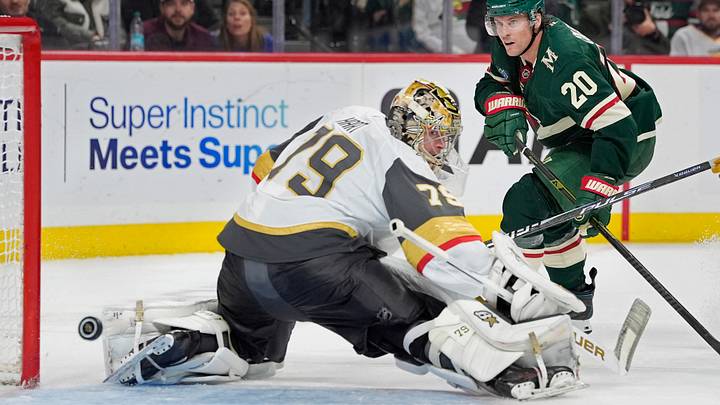 Minnesota Wild's Blake Coleman (20) shoots past Vegas Golden Knights goalie Carter Hart (79) in the second period at Grand Casino Arena.  Mandatory Credit: Bruce Kluckhohn-Imagn Images