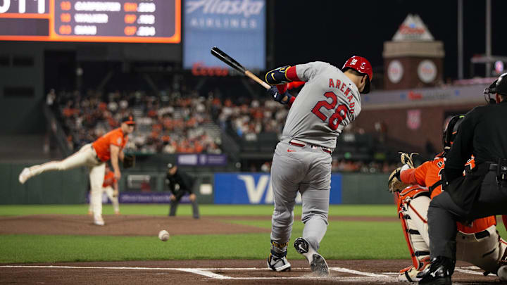 Sep 27, 2024; San Francisco, California, USA; St. Louis Cardinals third baseman Nolan Arenado (28) hits an RBI single off San Francisco Giants starting pitcher Landen Roupp (65) during the first inning at Oracle Park.