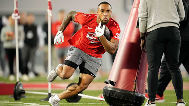 Ohio State running back TreVeyon Henderson works through a drill at a pro day in March. Ohio State running back TreVeyon Henderson works through a drill at a pro day in March.