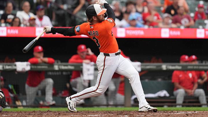 Aug 2, 2026; Baltimore, Maryland, USA; Baltimore Orioles designated hitter Taylor Ward (3) hits a single against the Philadelphia Phillies during the fourth inning at Oriole Park at Camden Yards. Mandatory Credit: Gregory Fisher-Imagn Images