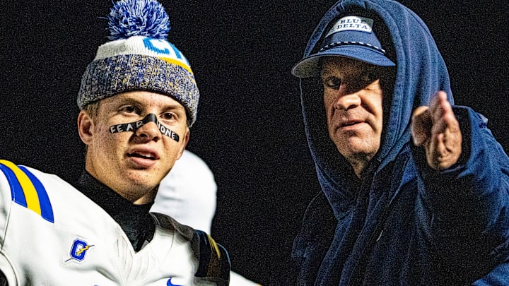 Oxford quarterback Knox Kiffin (13) talks with his dad and Ole Miss football head coach Lane Kiffin on the sidelines during a high school football game between Murrah and Oxford at Hughes Field in Jackson, Miss., on Thursday, Oct. 30, 2025.