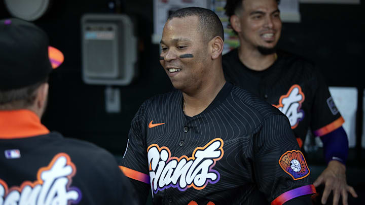 Jun 17, 2025; San Francisco, California, USA; San Francisco Giants designated hitter Rafael Devers (16) greets his new teammates in the dugout before taking on the Cleveland Guardians during the first inning at Oracle Park. 