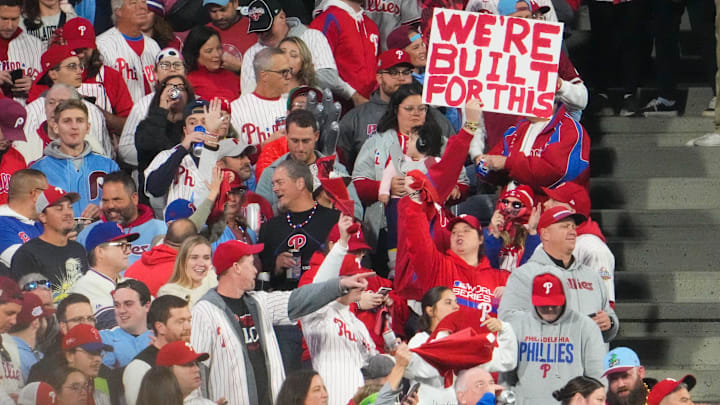 Fans hold a sign before the game between the Arizona Diamondbacks and the Philadelphia Phillies in
